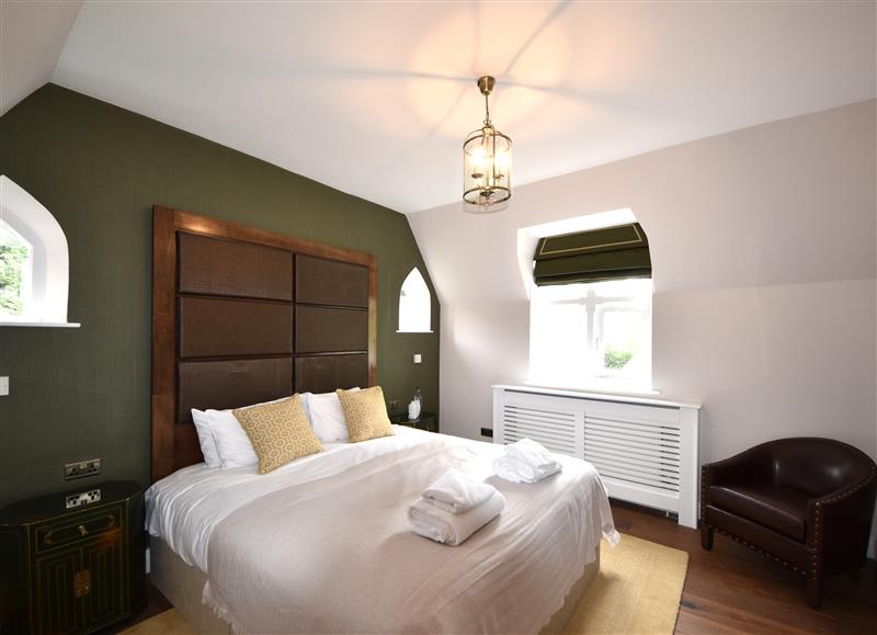A bedroom in The Gardeners Cottage at The Gardeners Cottage, Hook near Hartley Wintney