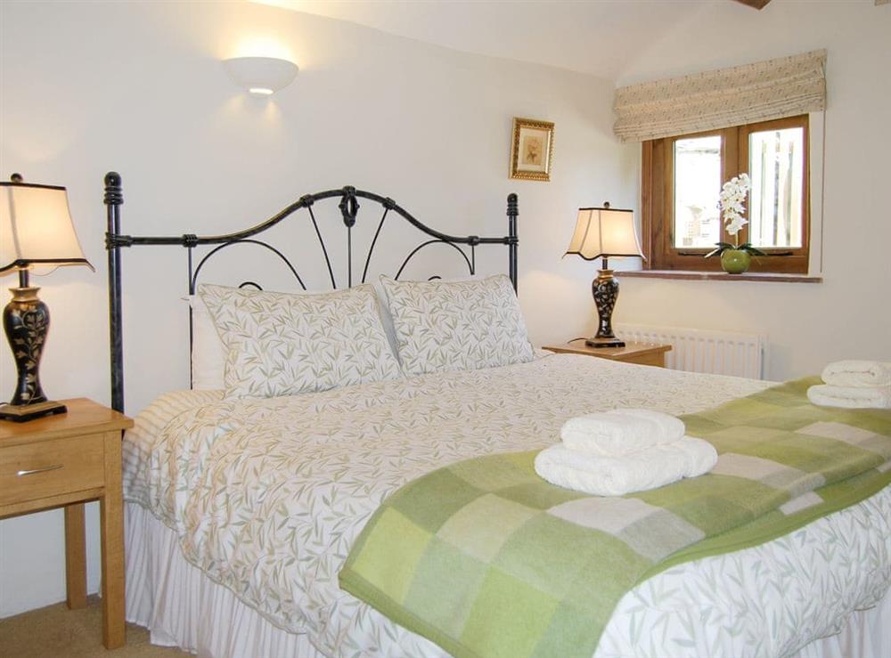 Comfortable master bedroom with kingsize bed at The Garth in Penrith, Cumbria
