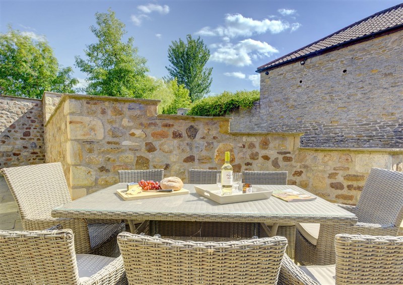 Enjoy a glass of wine on the patio at The Gate House, Aldbrough St. John near Barton
