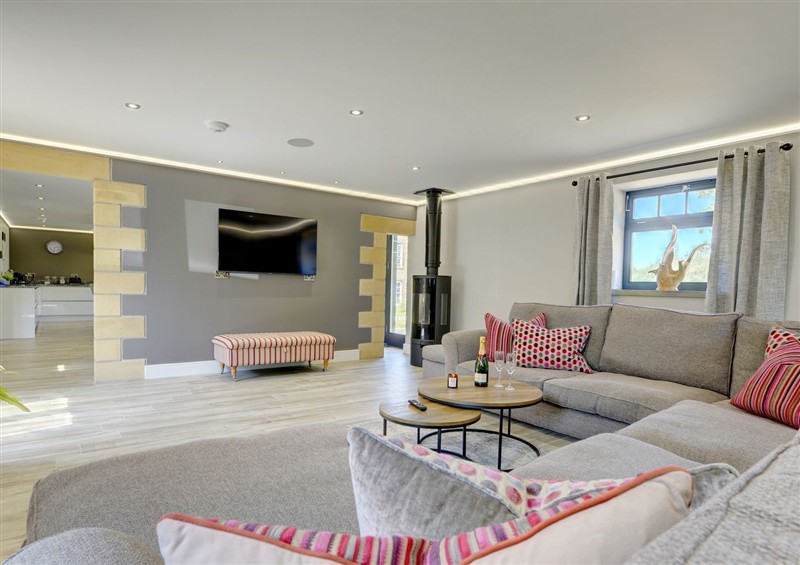 Relax in the living area (photo 5) at The Gate House, Aldbrough St. John near Barton