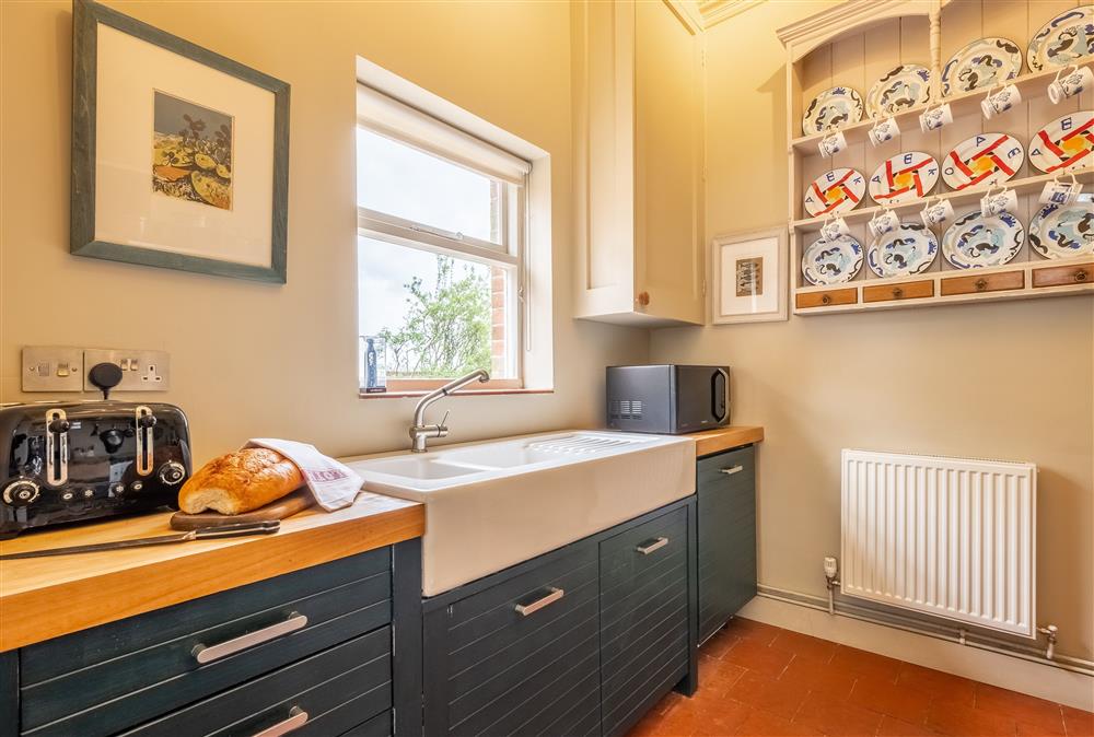 Kitchen with butler’s sink and views of the parkland at The Gate House, Aylsham near Norwich