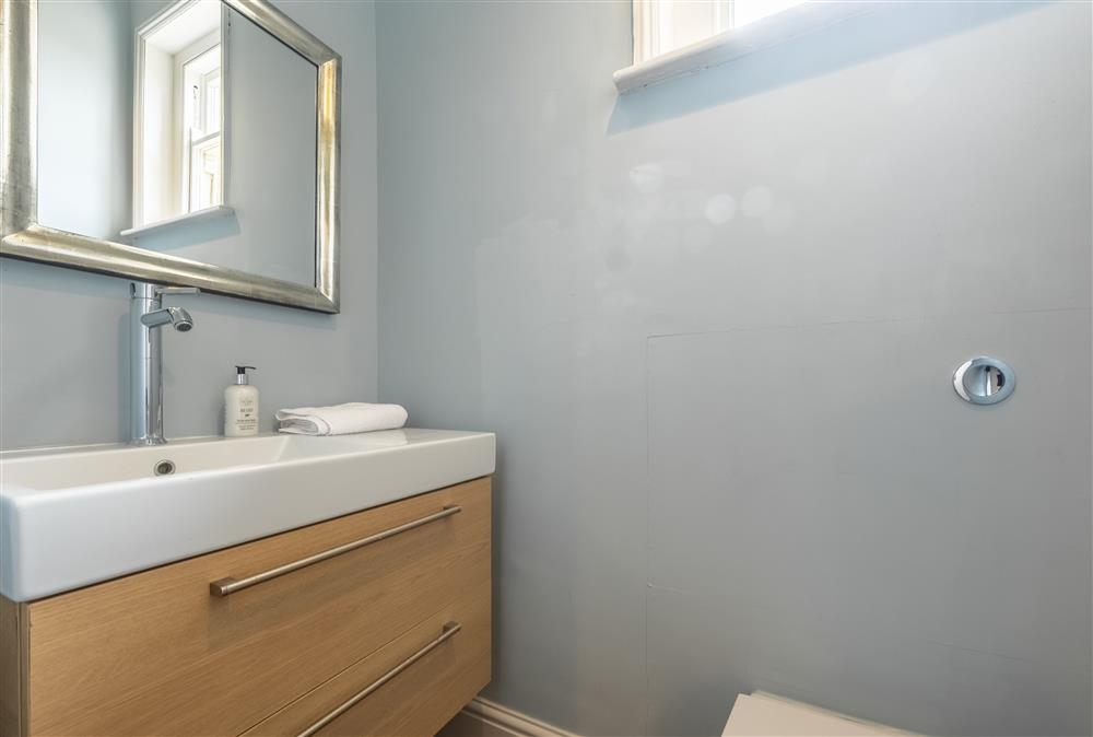 The downstairs cloakroom with a wash basin and WC at The Gate House, Aylsham near Norwich