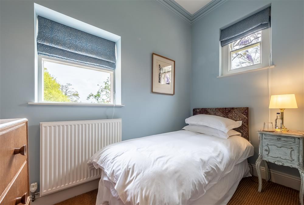 Bedroom three with a full size 3’ single bed with views of the parkland at The Gate House, Blickling near Norwich