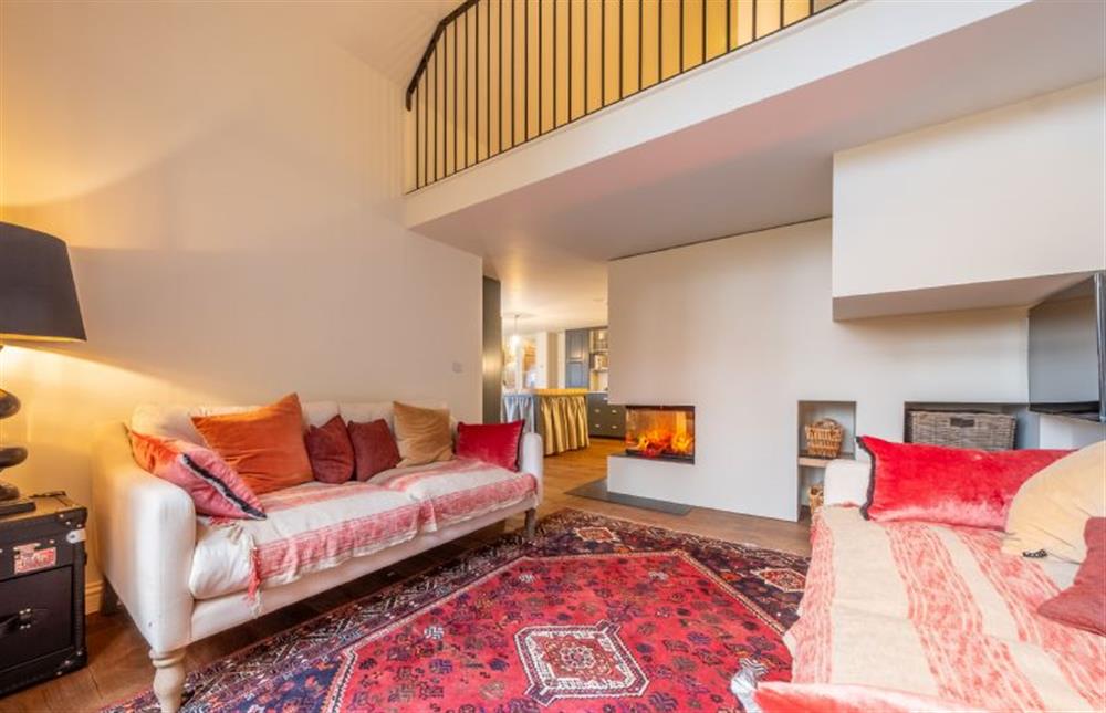 A mezzanine floor sits above the sitting room