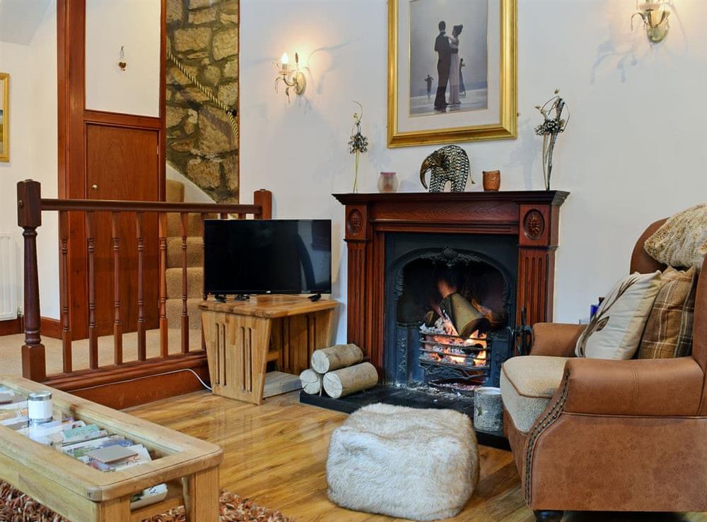 Warm and welcoming living/dining room with open fire (photo 2) at The Gate House in Markinch, near Glenrothes, Fife