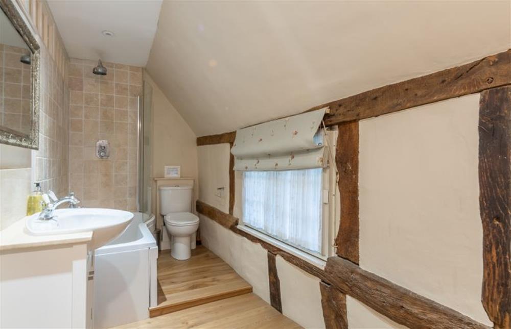 Bathroom with bath and shower over at The Gildhall, Higham