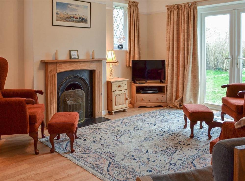 Lovely living room with patio doors to garden at The Glade in Ferring, Worthing, West Sussex