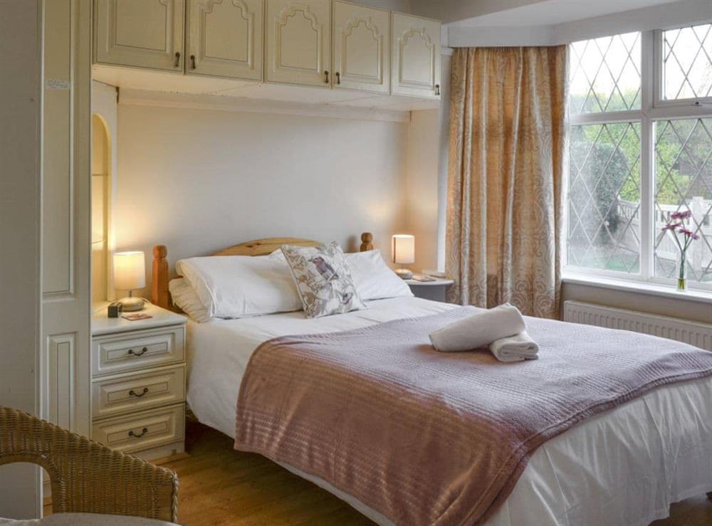 Peaceful double bedroom with ample built-in storage at The Glade in Ferring, Worthing, West Sussex