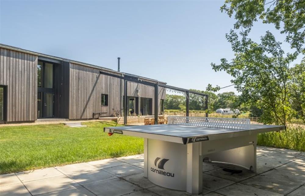A permanent table tennis sits in a secluded part of the garden at The Grain Store, Reepham
