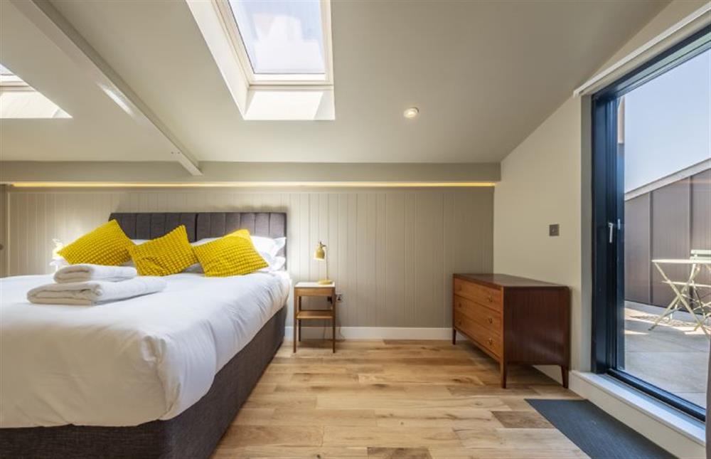 Bedroom two has a private  balcony at The Grain Store, Reepham