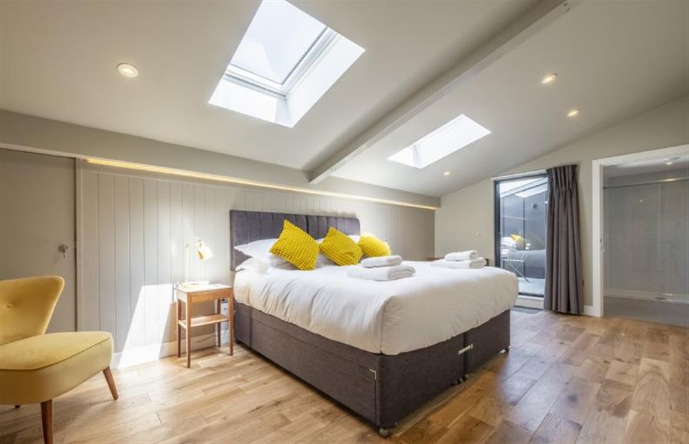 Bedroom two with 6’ super-king size bed at The Grain Store, Reepham