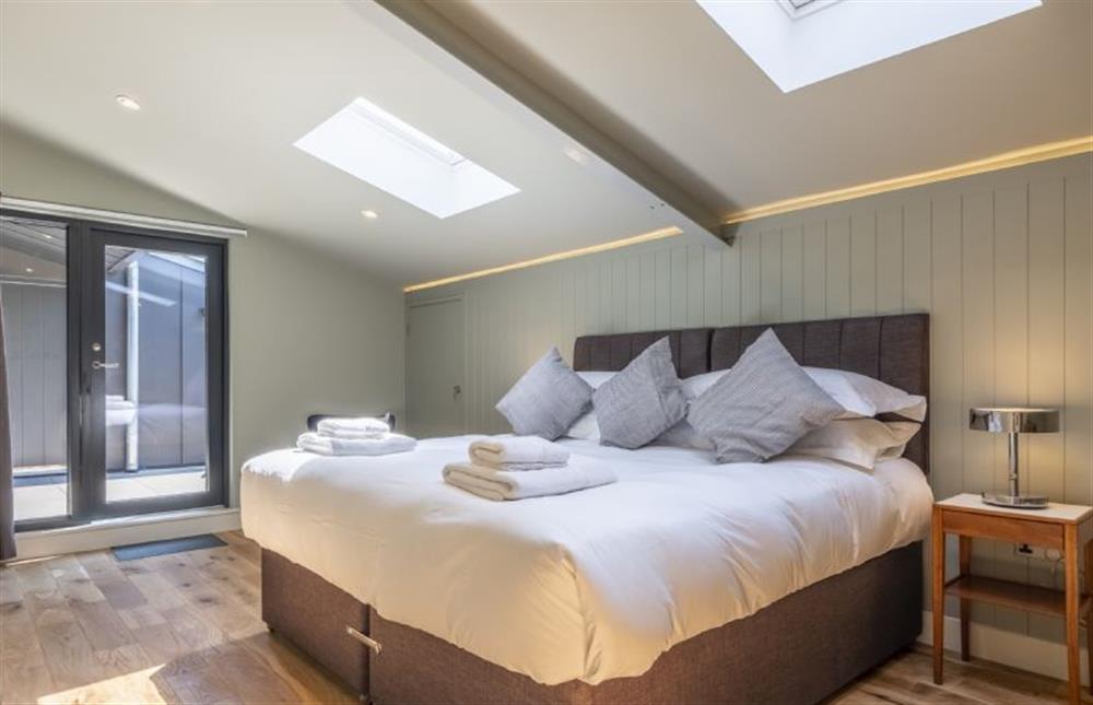 Master bedroom with 6’ super-king size bed at The Grain Store, Reepham