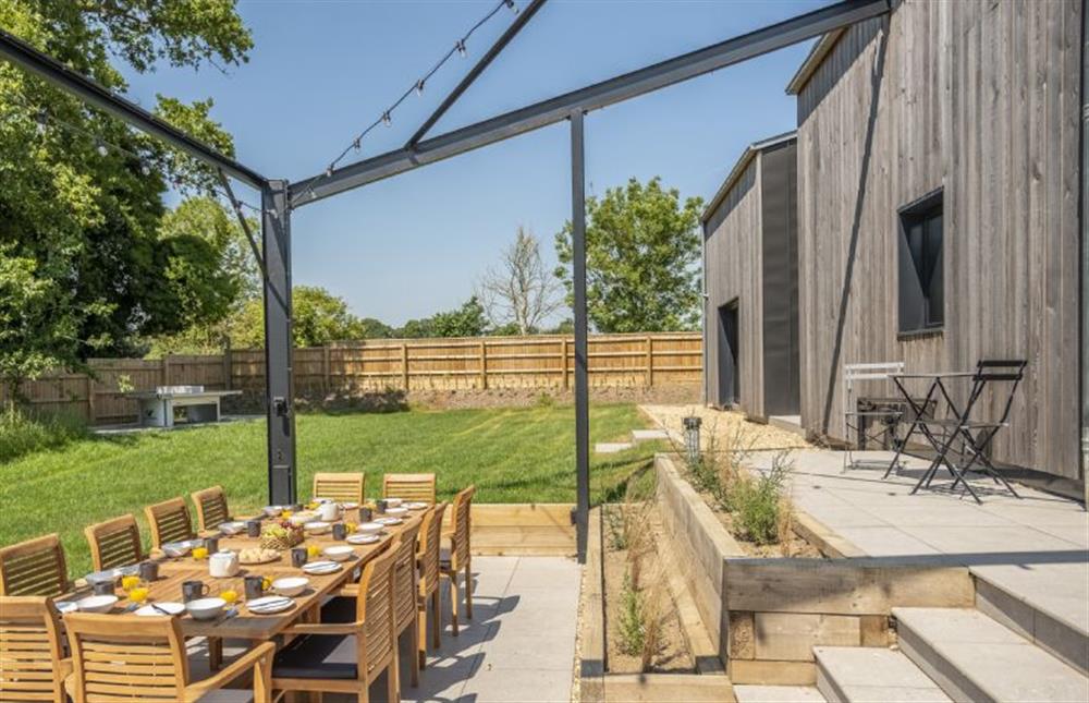 Steps lead down to the outdoor dining area at The Grain Store, Reepham