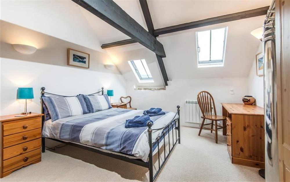 Double bed in bedroom 2 with vaulted ceiling at The Granary, Chideock in Bridport