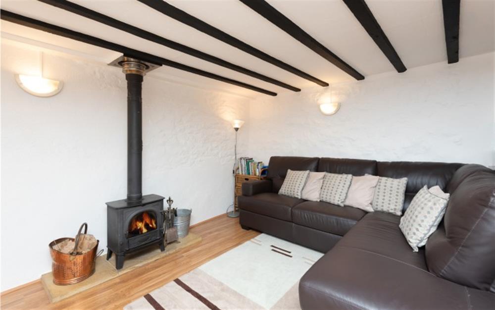 Lounge with wood burner at The Granary, Chideock in Bridport