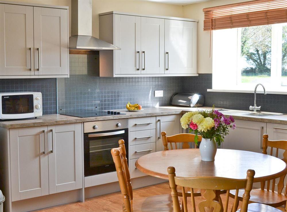 Kitchen with dining area at The Granary Cottage in Bamburgh, Northumberland., Great Britain