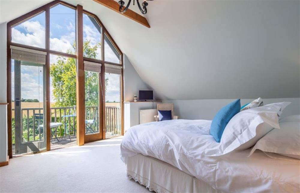 Master bedroom with king-size bed at The Granary, Dunstall Green, Dunstall Green