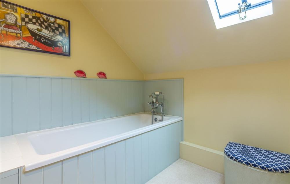 Family bathroom with bath and heated towel rail at The Granary, Hacheston