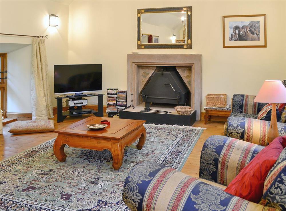 Cosy living room with wood burner at The Granary in Lanton, near Jedburgh, The Scottish Borders, Roxburghshire