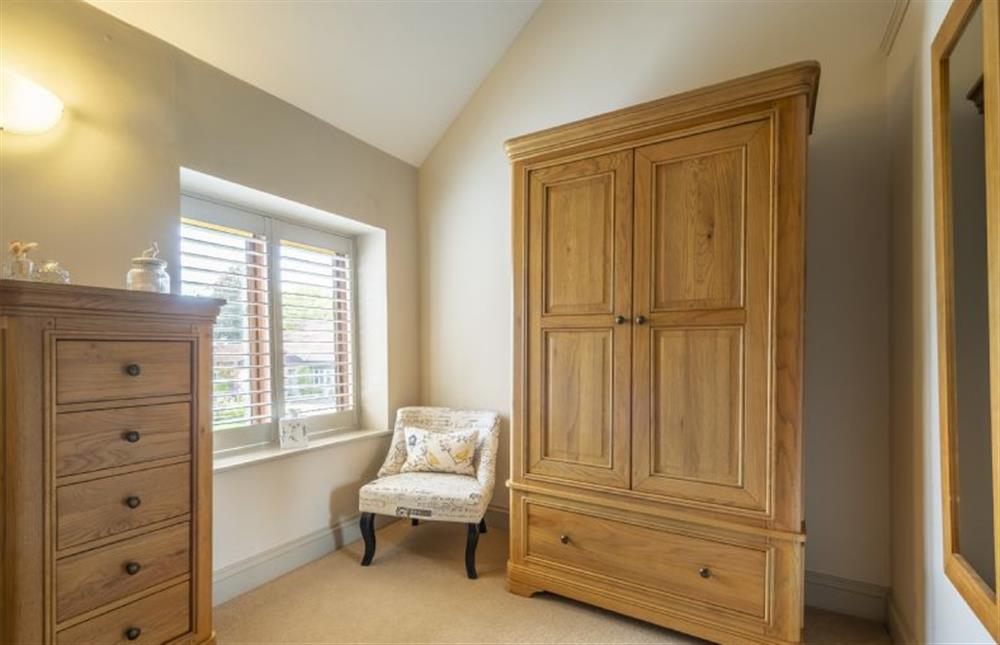 Bedroom two with wardrobe and clothes storage at The Granary, Oulton near Norwich