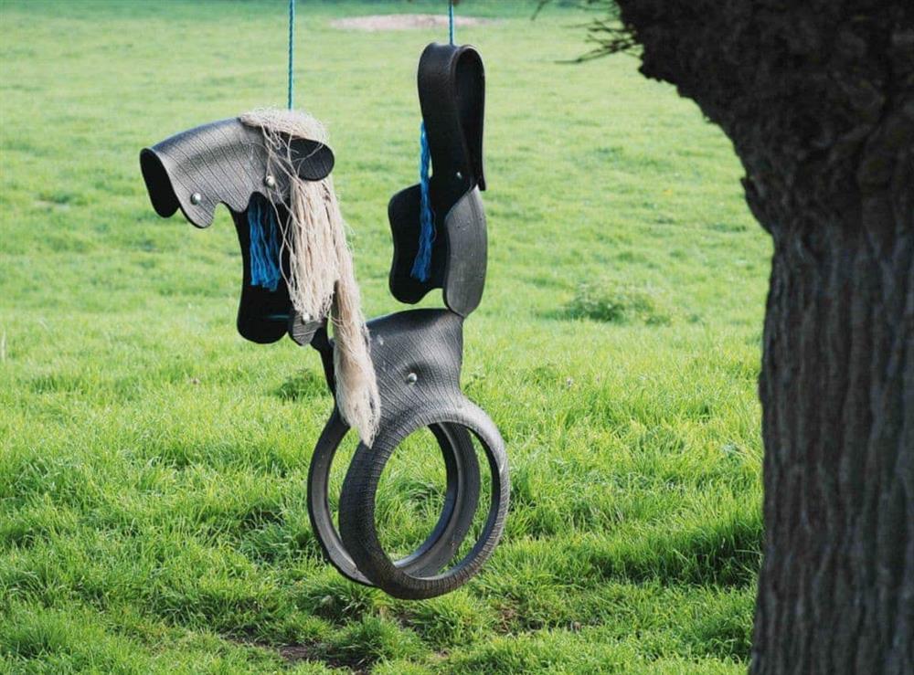 Tyre swing at The Granary in Oxborough, Norfolk., Great Britain