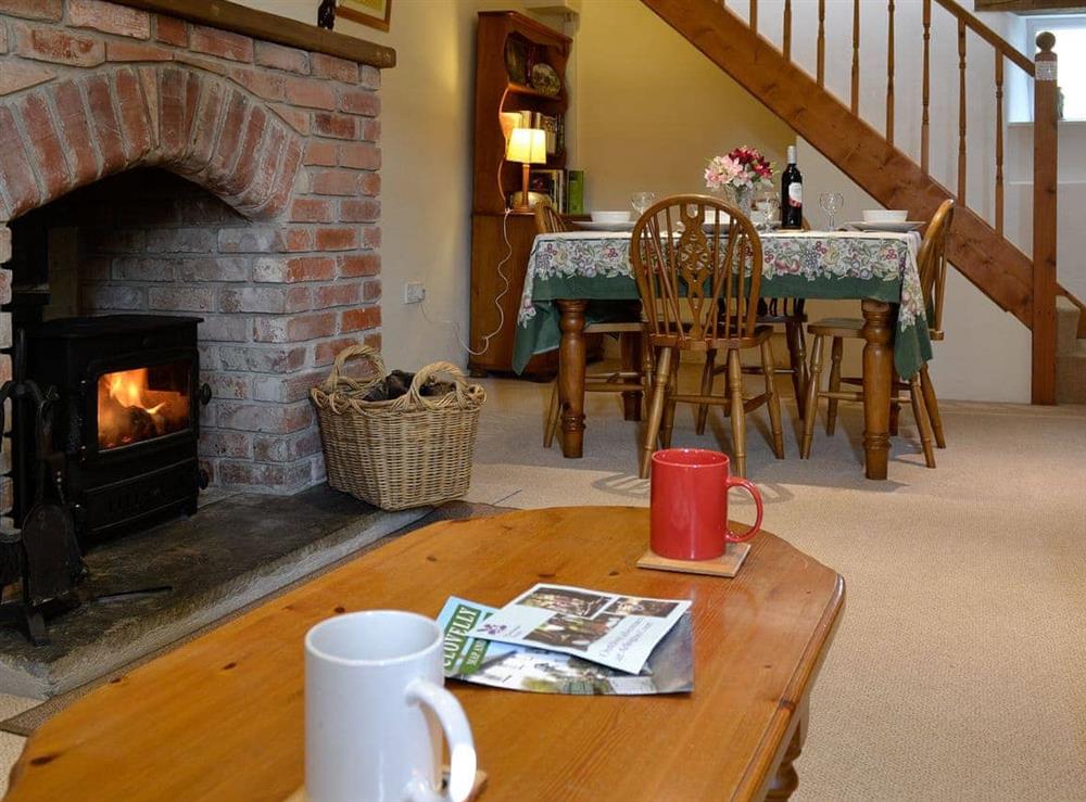 Living room with wood burner at The Granary in Shirwell, near Barnstaple, Devon