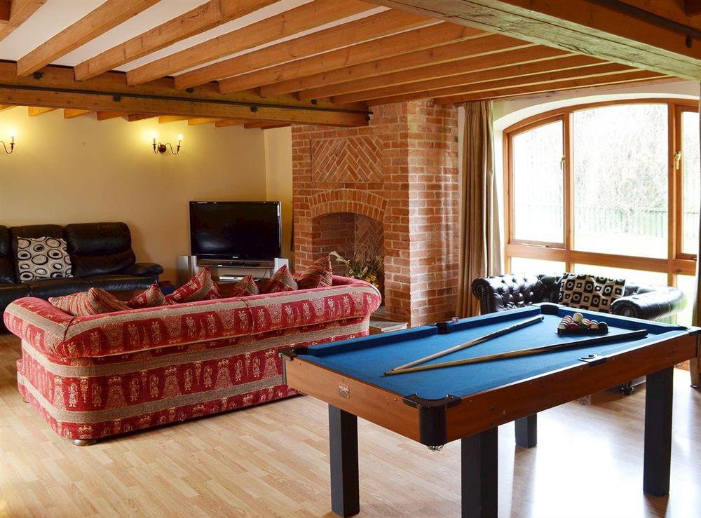 The light and airy living room also has a pool table at The Granary in Somersal Herbert, Ashbourne, Derbyshire