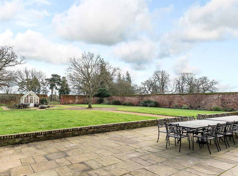 Enclosed walled garden and seating terrace at The Grange Farmhouse in Sculthorpe, Norfolk