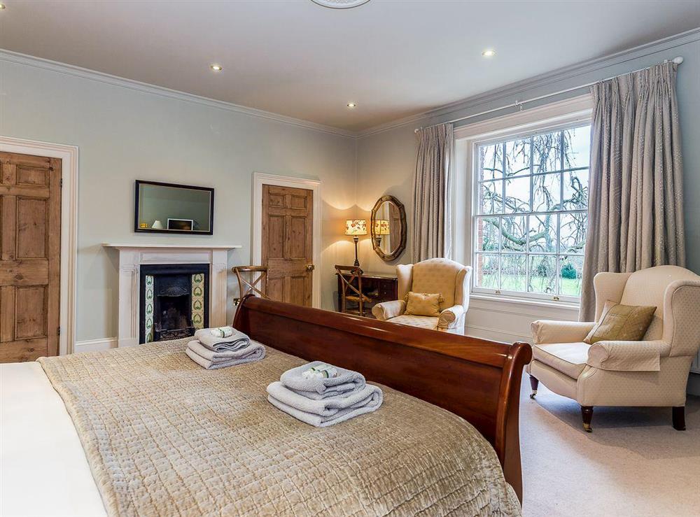 Grand double bedroom at The Grange Farmhouse in Sculthorpe, Norfolk