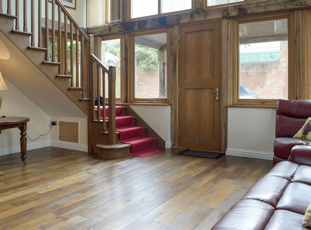 Entrance hallway with stairs to first floor at The Grange in Hope-under-Dinmore, near Leominster, Herefordshire