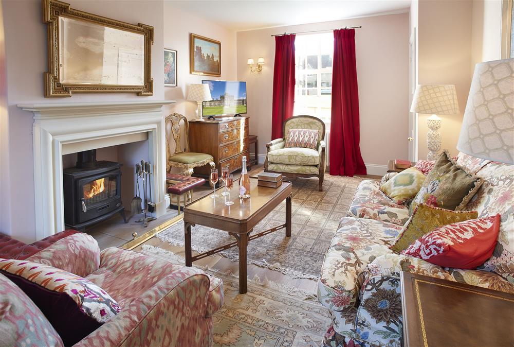 Spacious sitting room with wood burning stove at The Green, Castle Howard, Coneysthorpe