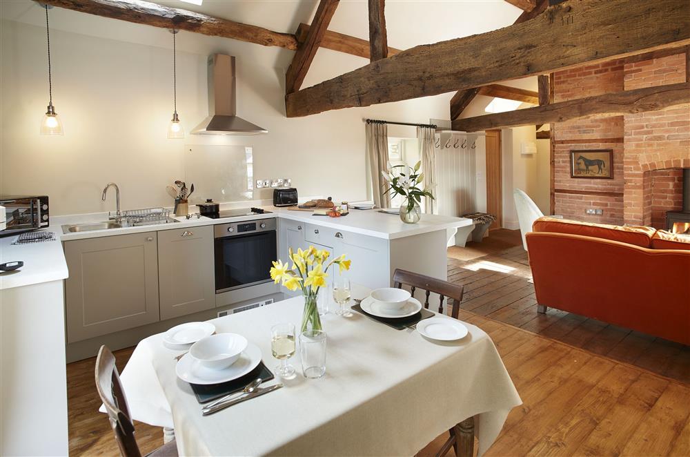 The Groomfts Flat, Herefordshire: Dining area with a dining table and seating for two guests at The Grooms Flat, Leominster