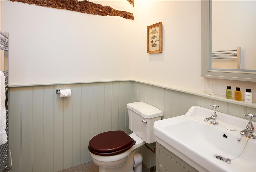 The Groomfts Flat, Herefordshire: En-suite bathroom with exposed beams at The Grooms Flat, Leominster