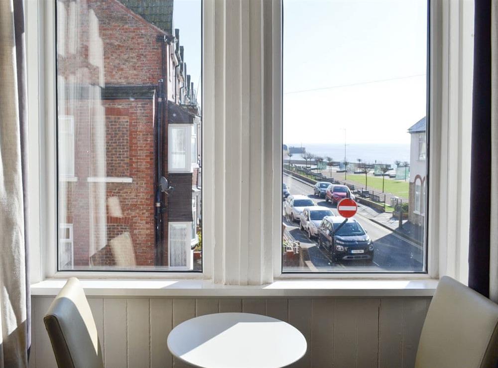 Intimate dining area within the living room at The Harbour Masters House in Bridlington, North Humberside