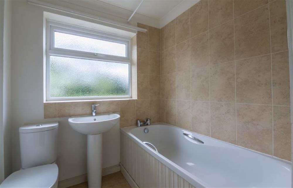 Ground floor: Bath with shower over at The Hares, Brancaster near Kings Lynn