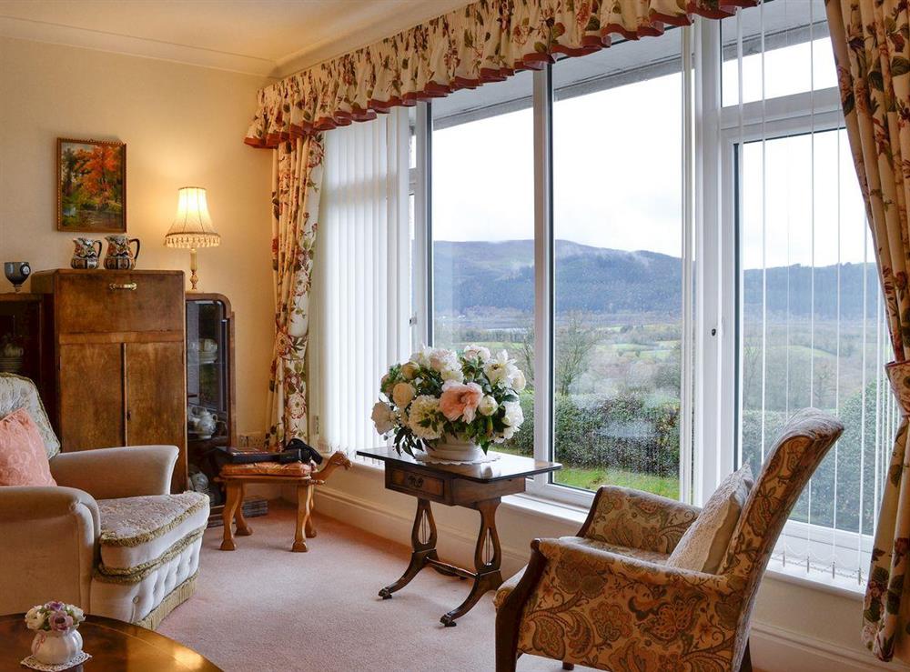 Living room with stunning window views at The Hawthorns in Bassenthwaite, near Keswick, Cumbria