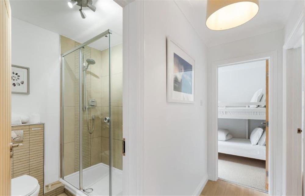 Access to the family shower room with a large shower cubicle, heated towel rail. wash basin and WC. at The Hawthorns, St Minver