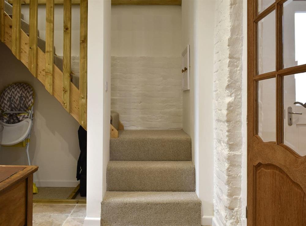 Stairs to the mezzanine area at The Hay Barn in Beccles, Suffolk