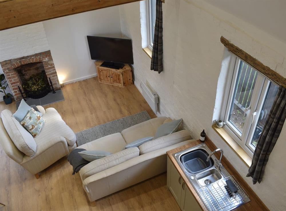 View over the living areas from the mezzanine at The Hay Barn in Beccles, Suffolk