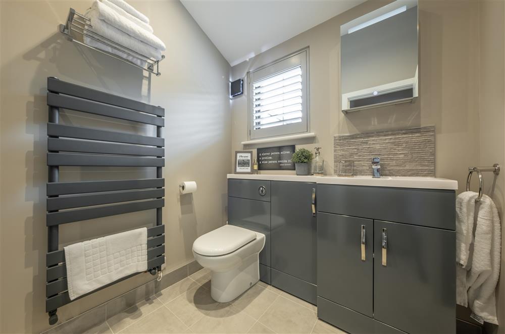 En-suite shower room to bedroom two with walk-in rain shower at The Haybarn, Surrey Hills