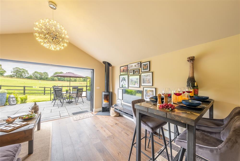 Open-plan kitchen, dining and sitting area at The Haybarn, Surrey Hills