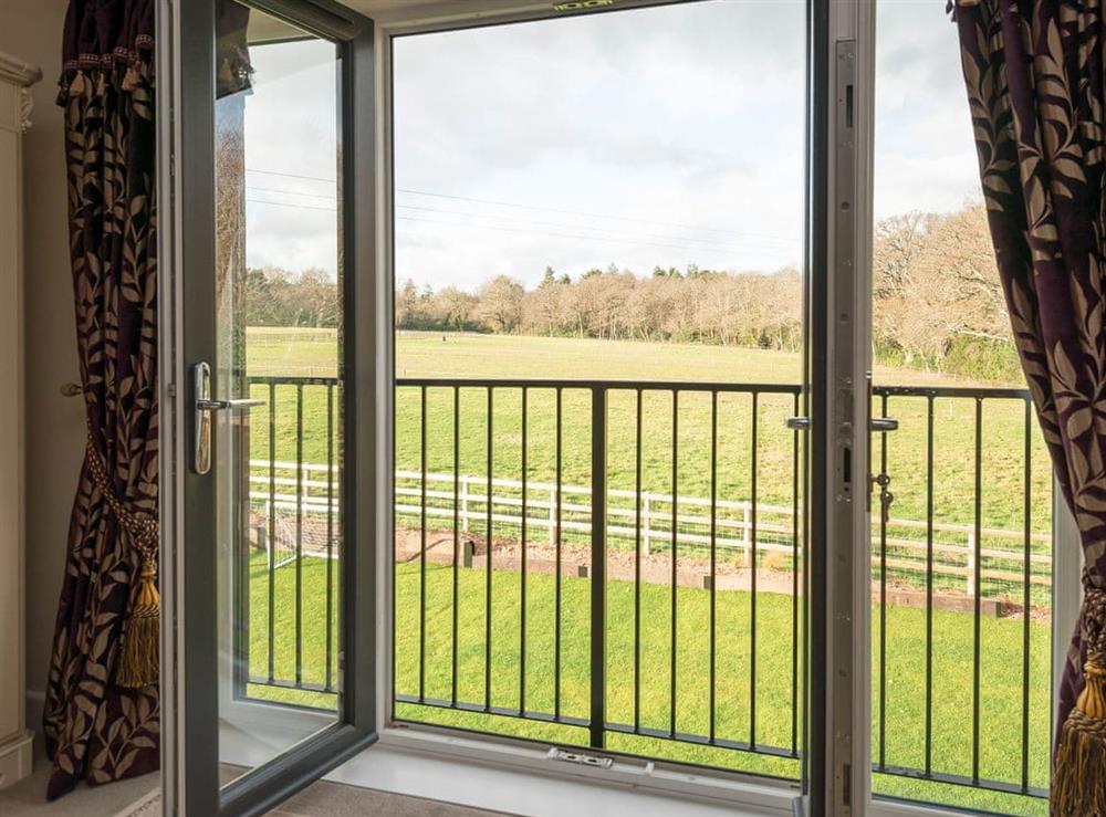 French doors leading to private decking at The Haybarn in Wimbourne, Dorset