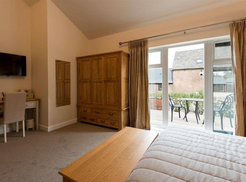 Relaxing bedroom with kingsize bed and en-suite (photo 2) at The Haybarn in Wimbourne, Dorset