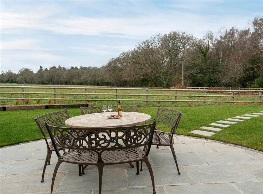 Sitting-out-area with view s over fields at The Haybarn in Wimbourne, Dorset