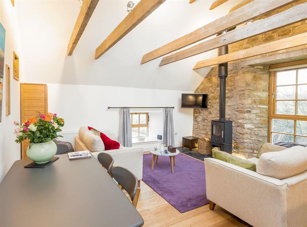 Open plan living space with character and beamed ceiling at The Hayloft in Balerno, near Edinburgh, Midlothian