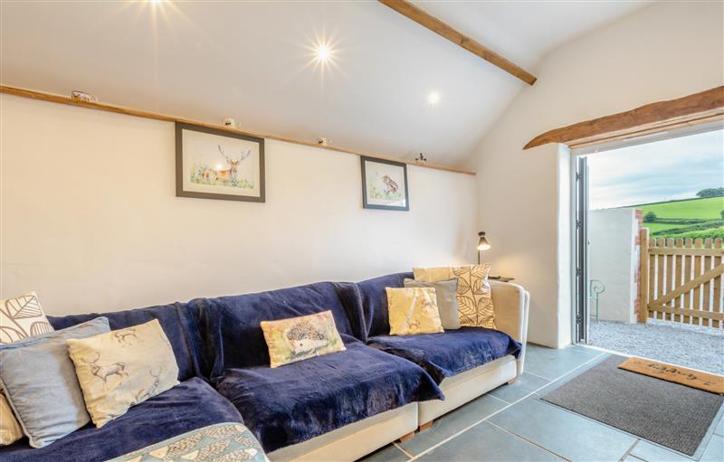 Relax in the living area at The Hayloft, Bampton
