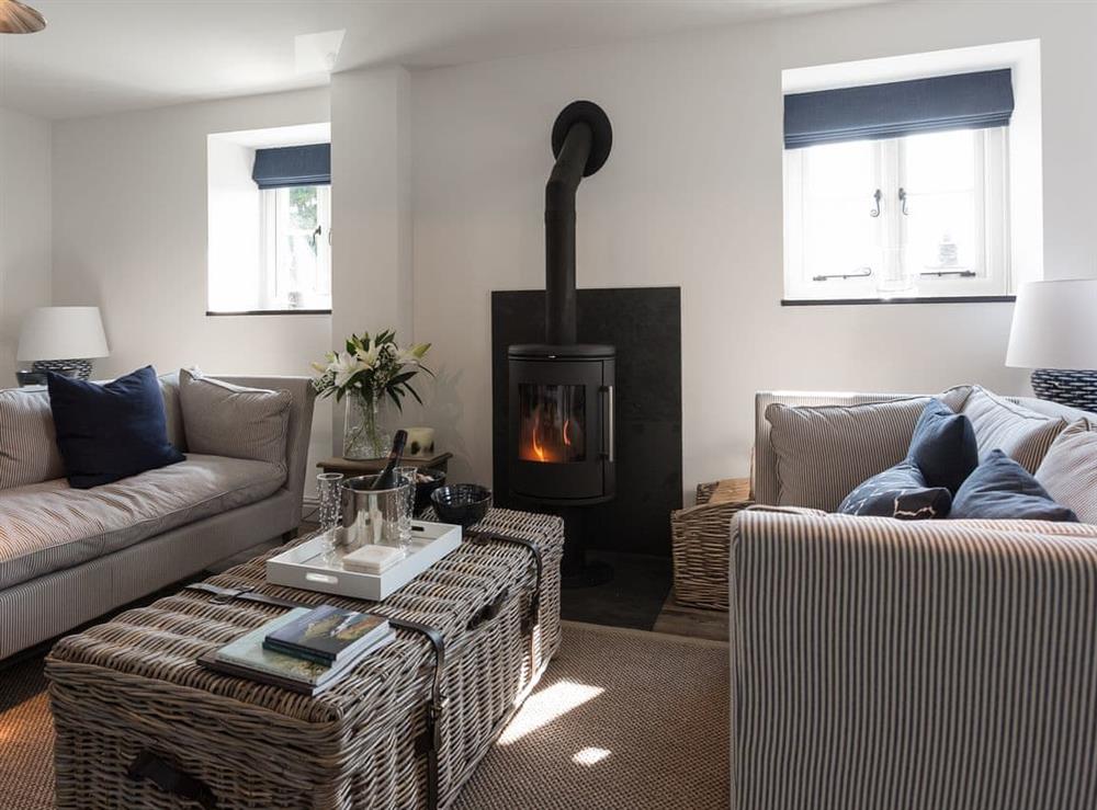 Beautifully presented, spacious living room with wood burner (photo 2) at The Hayloft in Boscastle, near Bodmin, Cornwall