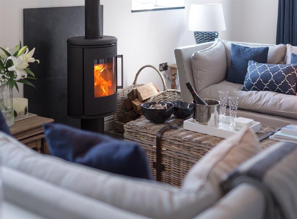 Beautifully presented, spacious living room with wood burner at The Hayloft in Boscastle, near Bodmin, Cornwall