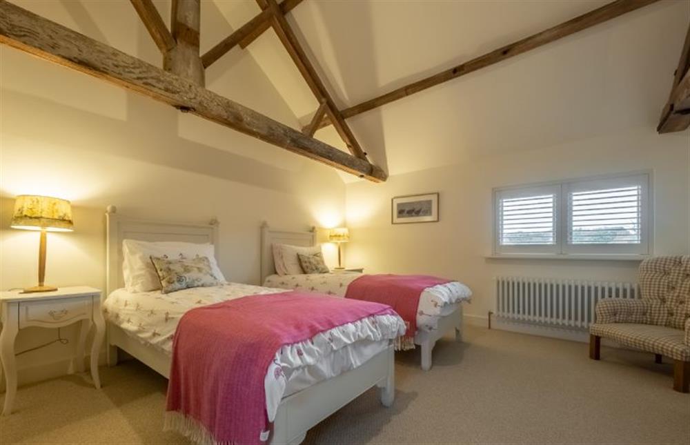 Bedroom four with full-size 3’ twin beds at The Hayloft, Felbrigg near Norwich