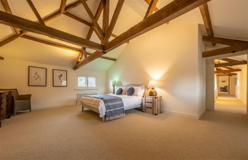 Bedroom two with 5’ king-size bed at The Hayloft, Felbrigg near Norwich